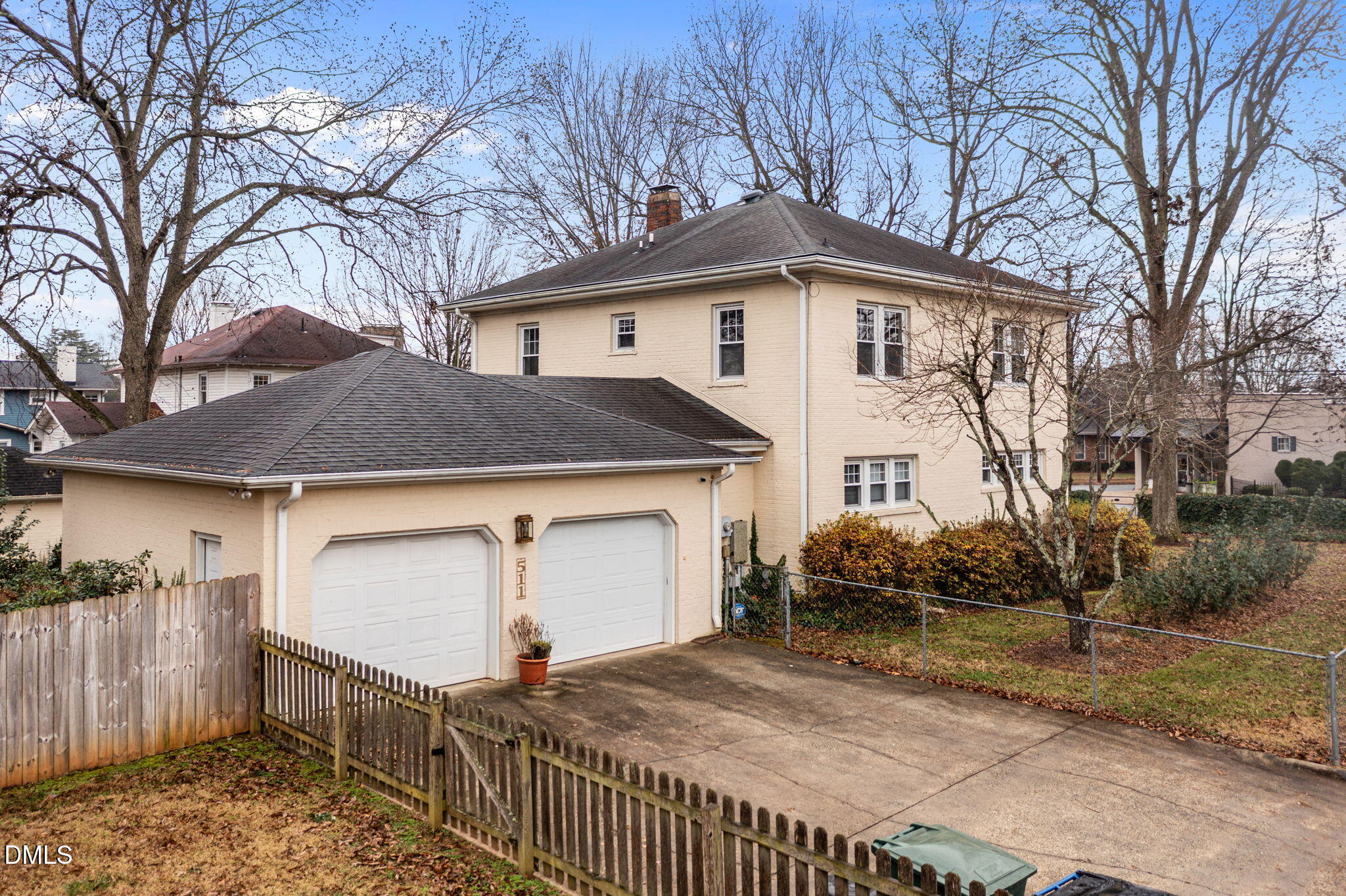 511 North Main Street Graham, NC 27253 - Photo 36 of 42 a front view of a house with a yard and garage