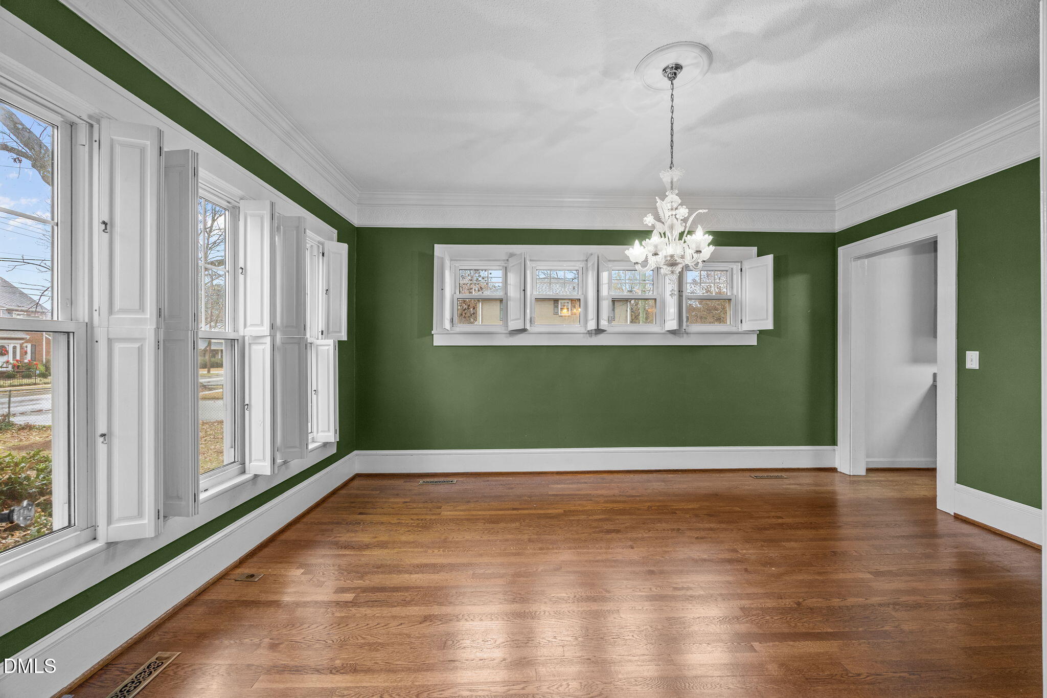 511 North Main Street Graham, NC 27253 - Photo 5 of 42 a view of a room with window wooden floor and chandelier