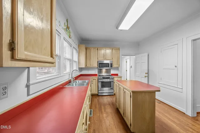 a view of a room with wooden floor large window and outdoor view