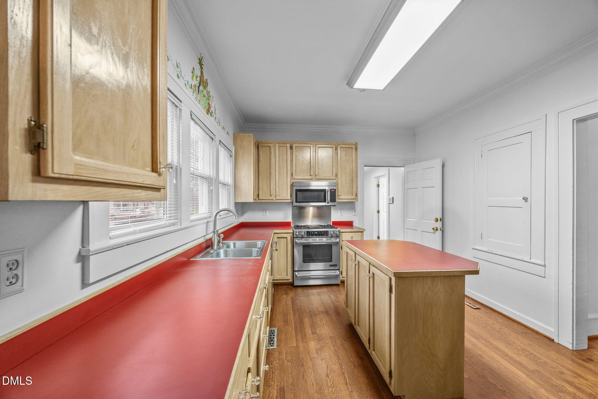 511 North Main Street Graham, NC 27253 - Photo 7 of 42 a kitchen with stainless steel appliances a stove a sink and a refrigerator