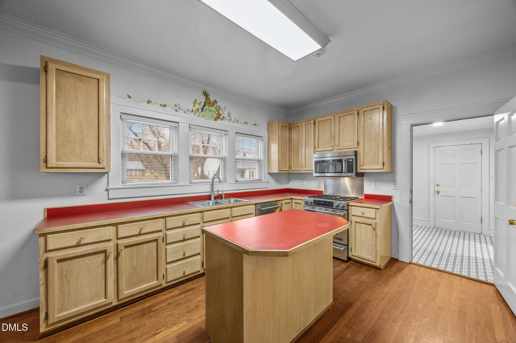 511 North Main Street Graham, NC 27253 - Photo 8 of 42 a kitchen with stainless steel appliances granite countertop a sink and a refrigerator
