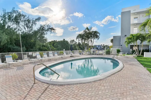 a view of a swimming pool with a terrace