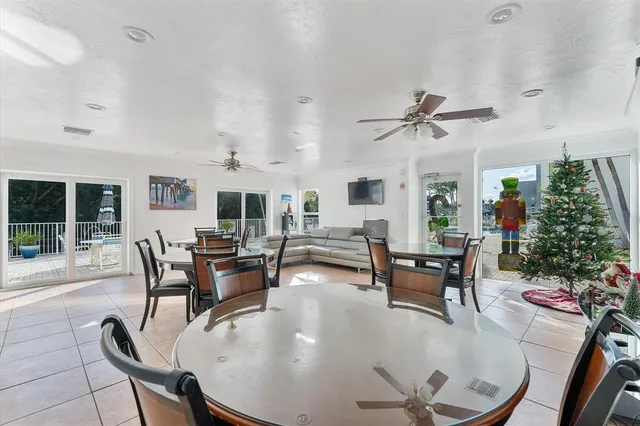 an aerial view of a house with pool patio and outdoor seating
