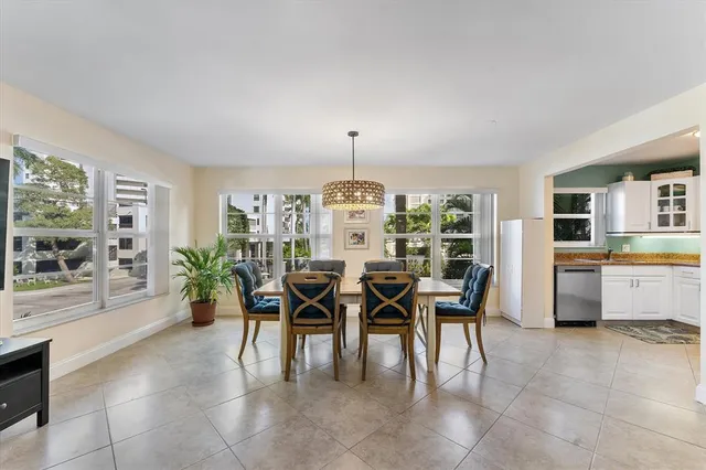a view of a dining room with furniture and a window