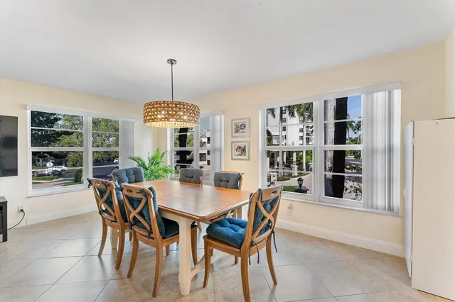 a dining room with furniture and window