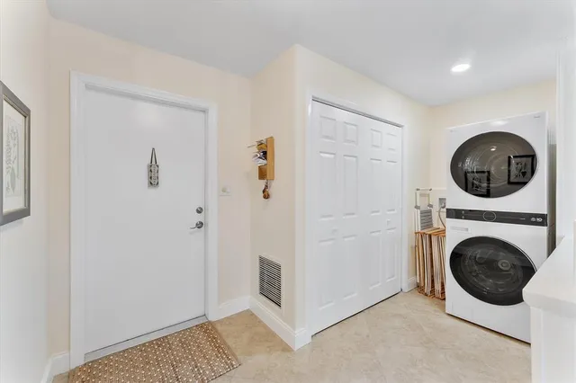 a view of a hallway with washer and dryer