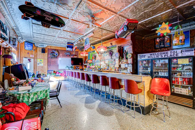 a room with lots of furniture and white walls