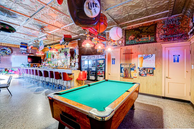 a group of people sitting outside of a restaurant