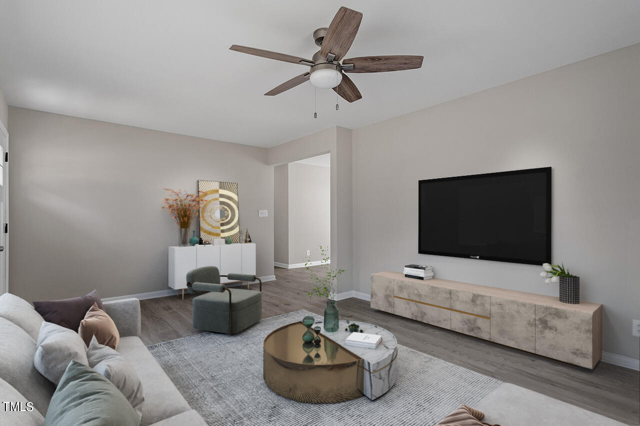 1416 Valley Road Garner, NC 27529 - Photo 5 of 38 a living room with furniture and a flat screen tv