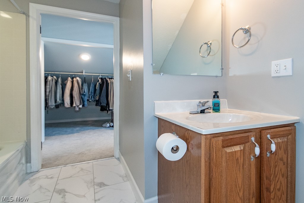1314 Mayfield Ridge Road Cleveland, OH 44124 - Photo 23 of 40 Bathroom with bathing tub / shower combination, vanity, and tile patterned floors