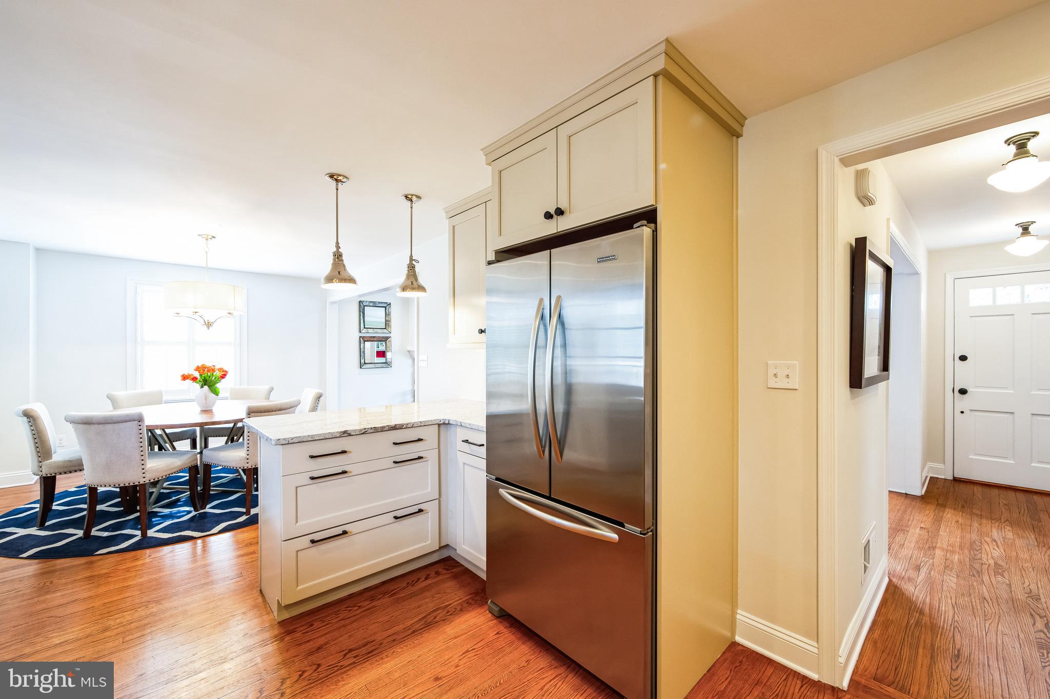 131 Clover Hill Lane Wayne, PA 19087 - Photo 12 of 50 a kitchen with stainless steel appliances a refrigerator and a stove top oven