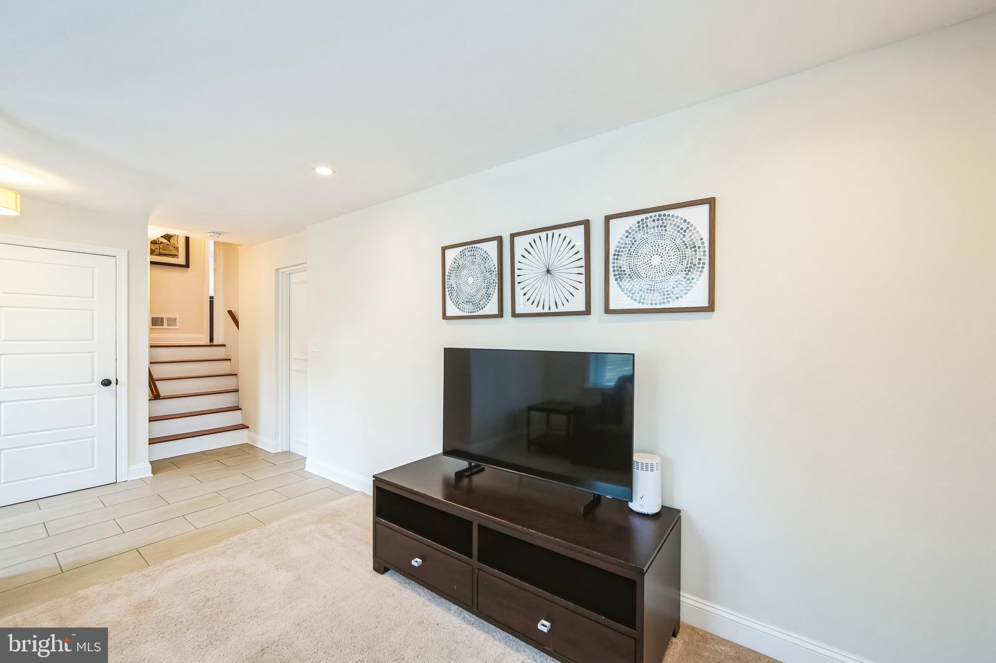 131 Clover Hill Lane Wayne, PA 19087 - Photo 16 of 50 a living room with furniture and a fireplace