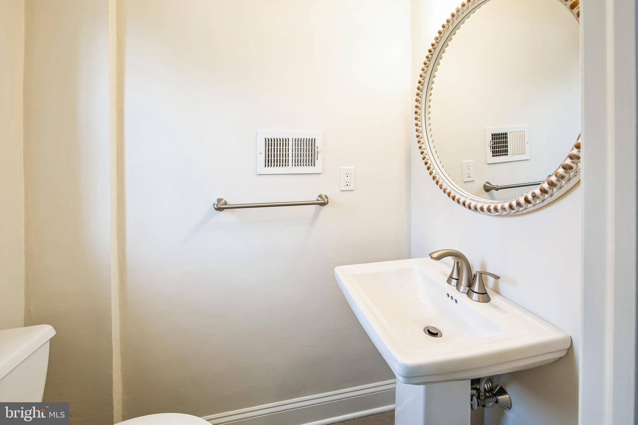 131 Clover Hill Lane Wayne, PA 19087 - Photo 18 of 50 a bathroom with a sink and a mirror