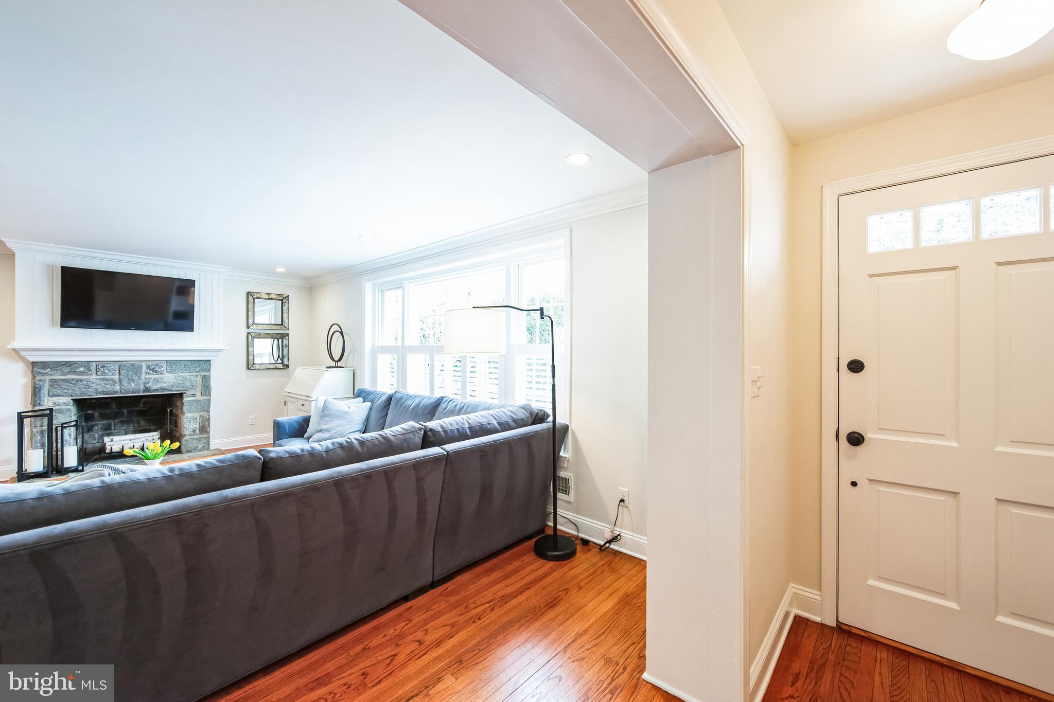 131 Clover Hill Lane Wayne, PA 19087 - Photo 2 of 50 a living room with furniture and a fireplace