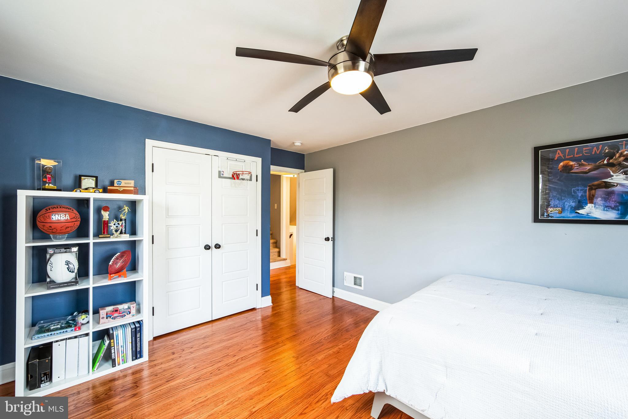 131 Clover Hill Lane Wayne, PA 19087 - Photo 26 of 50 a bedroom with a bed and a book shelf