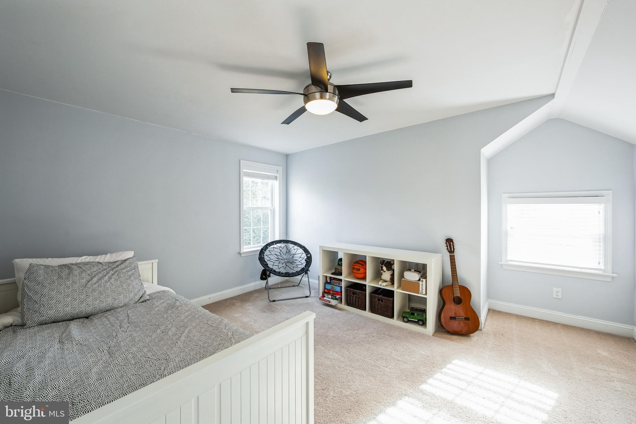 131 Clover Hill Lane Wayne, PA 19087 - Photo 30 of 50 a room with a bed and a chandelier