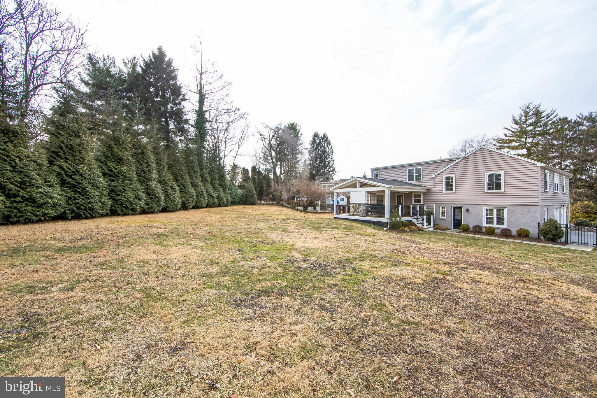 131 Clover Hill Lane Wayne, PA 19087 - Photo 41 of 50 a backyard of a house with large trees