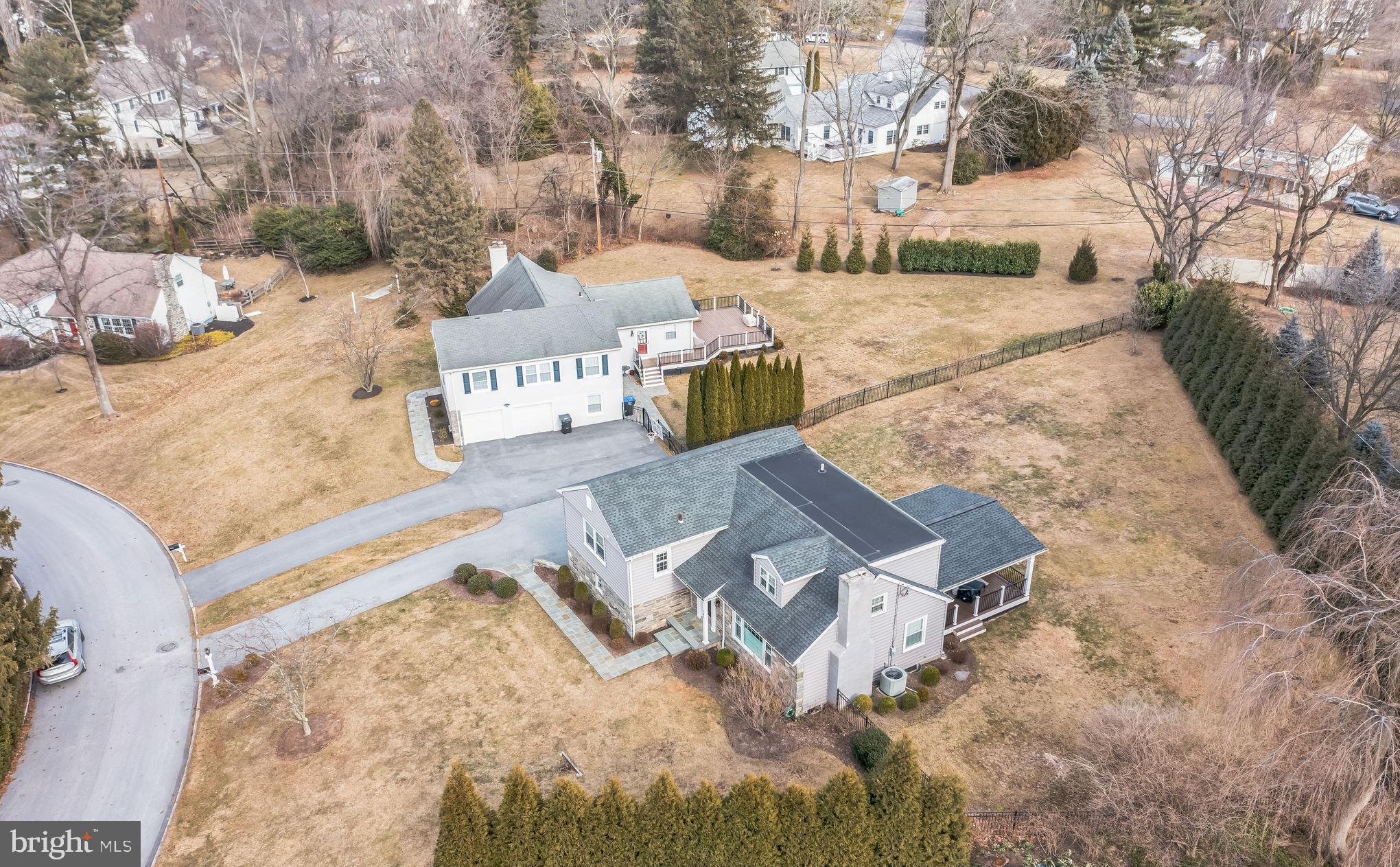 131 Clover Hill Lane Wayne, PA 19087 - Photo 45 of 50 a view of a houses with yard and trees