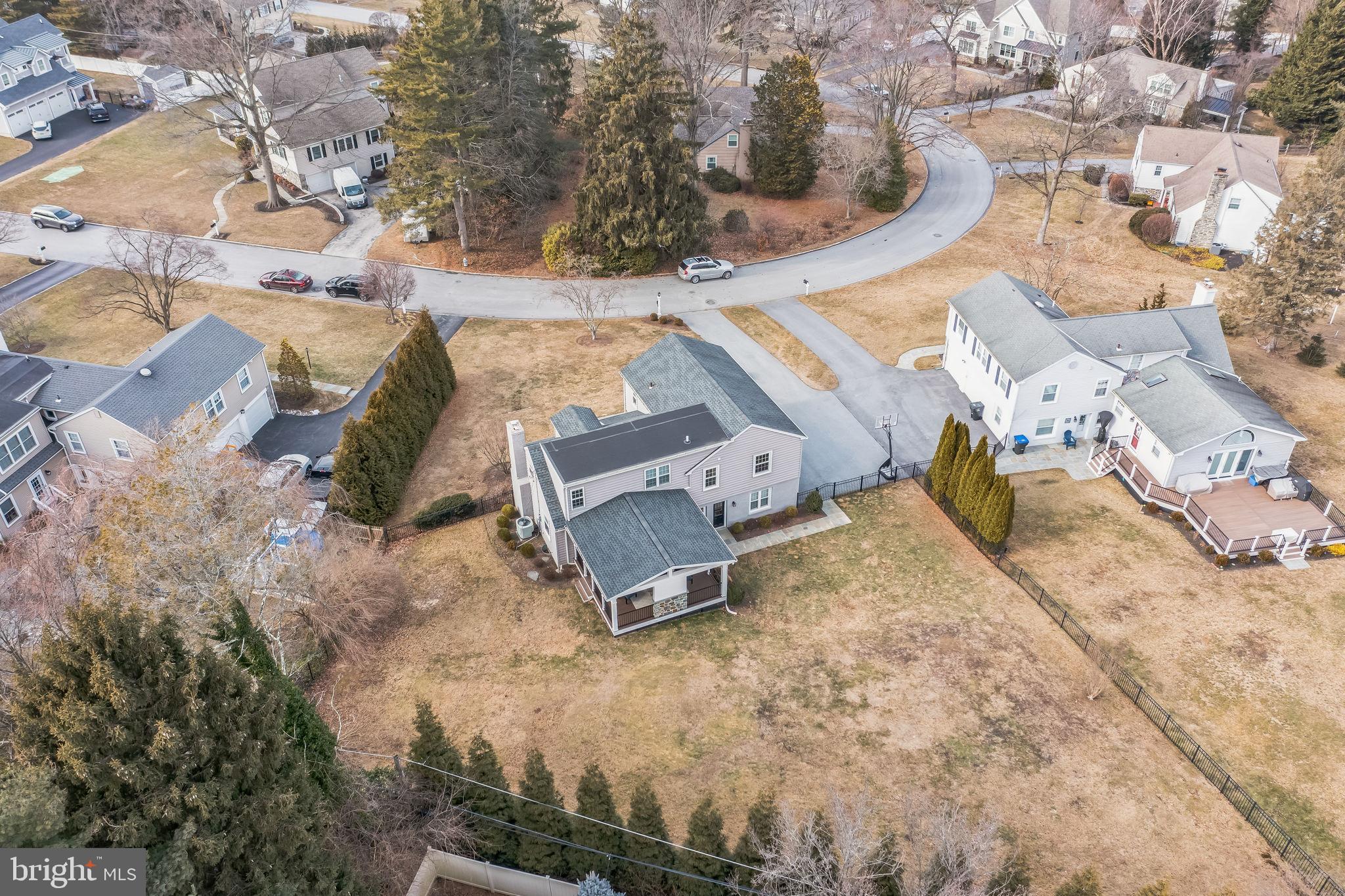 131 Clover Hill Lane Wayne, PA 19087 - Photo 47 of 50 an aerial view of a house with a yard and lake view