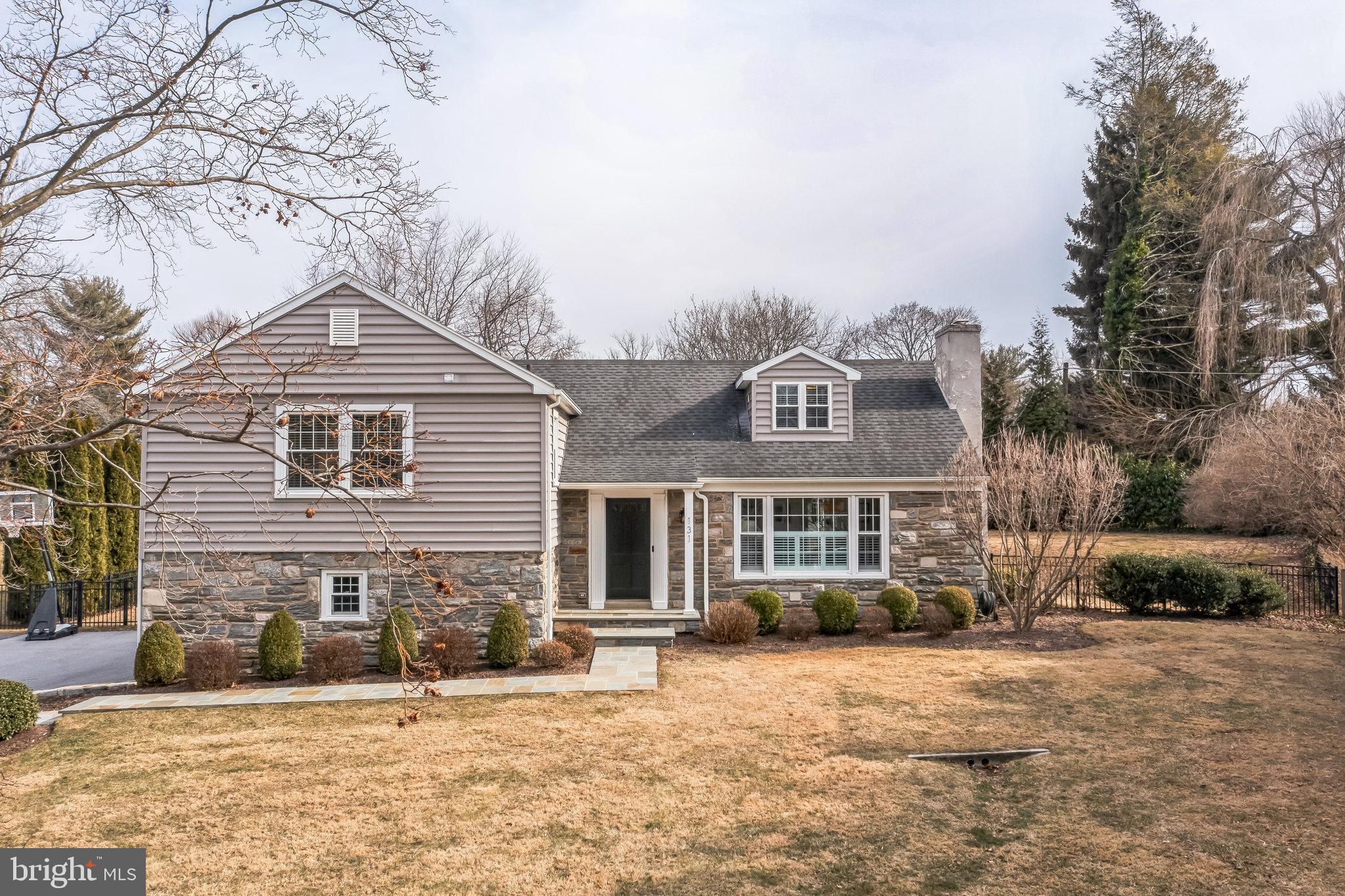131 Clover Hill Lane Wayne, PA 19087 - Photo 50 of 50 a front view of a house with a yard