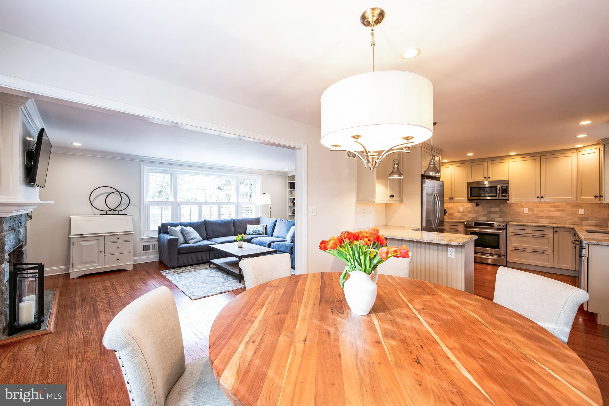 131 Clover Hill Lane Wayne, PA 19087 - Photo 6 of 50 a living room with kitchen island furniture and a wooden floor