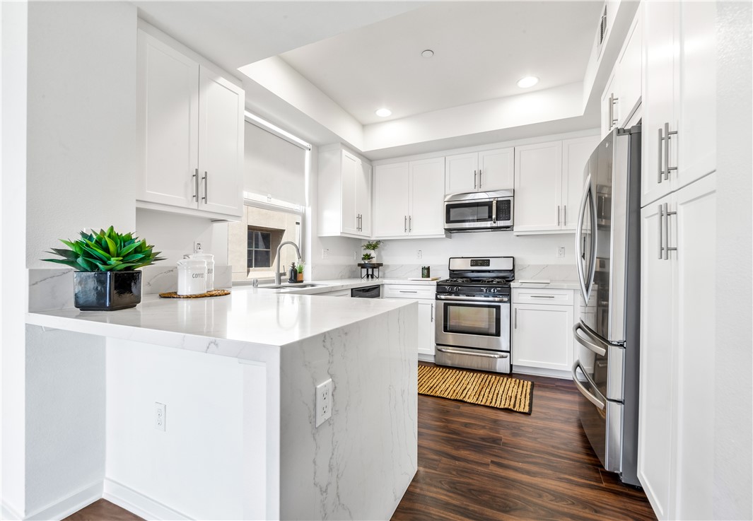 764 Colorado Circle Carson, CA 90745 - Photo 9 of 56 Kitchen is open to the living room.
