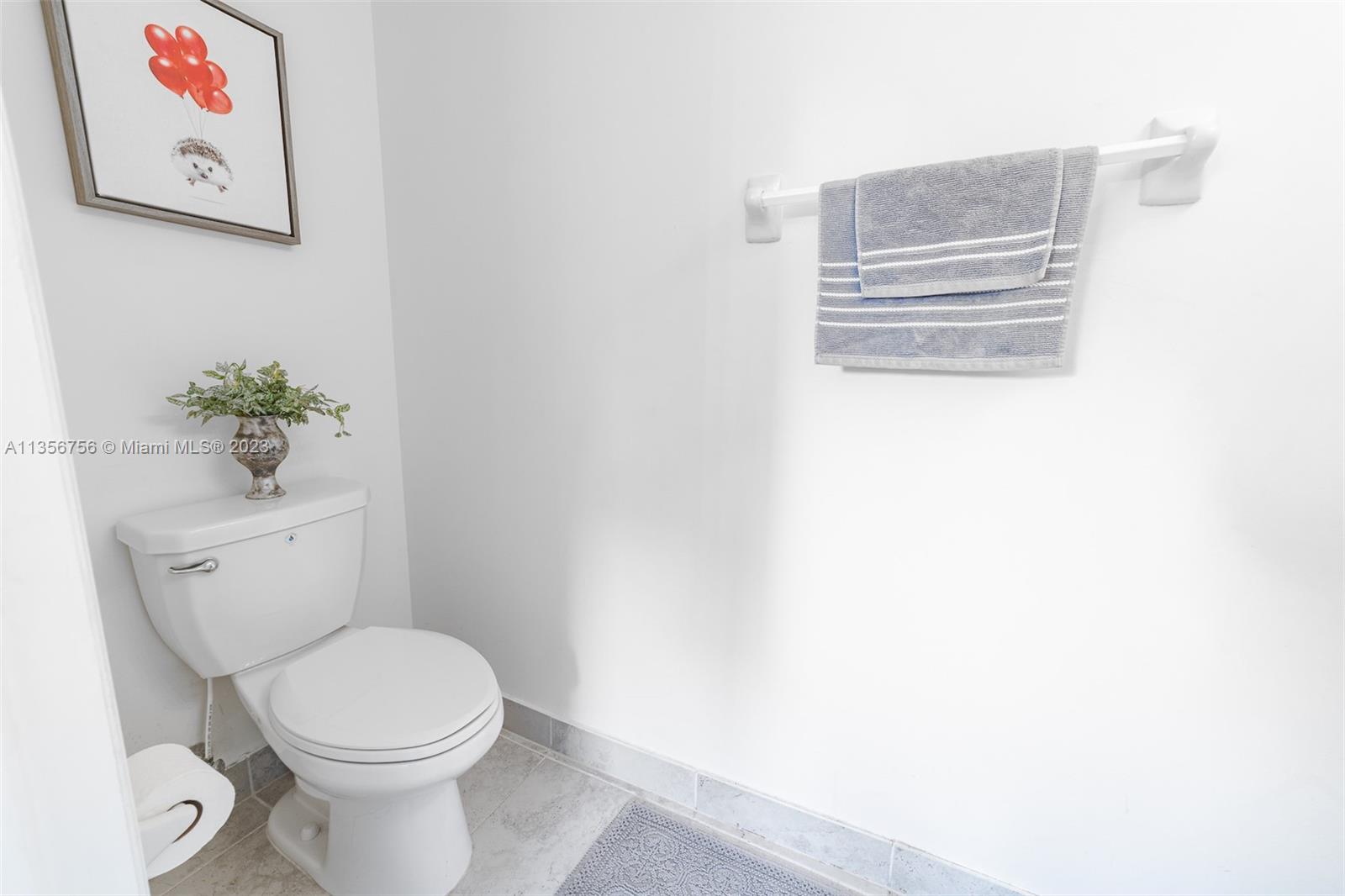 11444 Southwest 251st Street Homestead, FL 33032 - Photo 12 of 40 a bathroom with a toilet and a sink