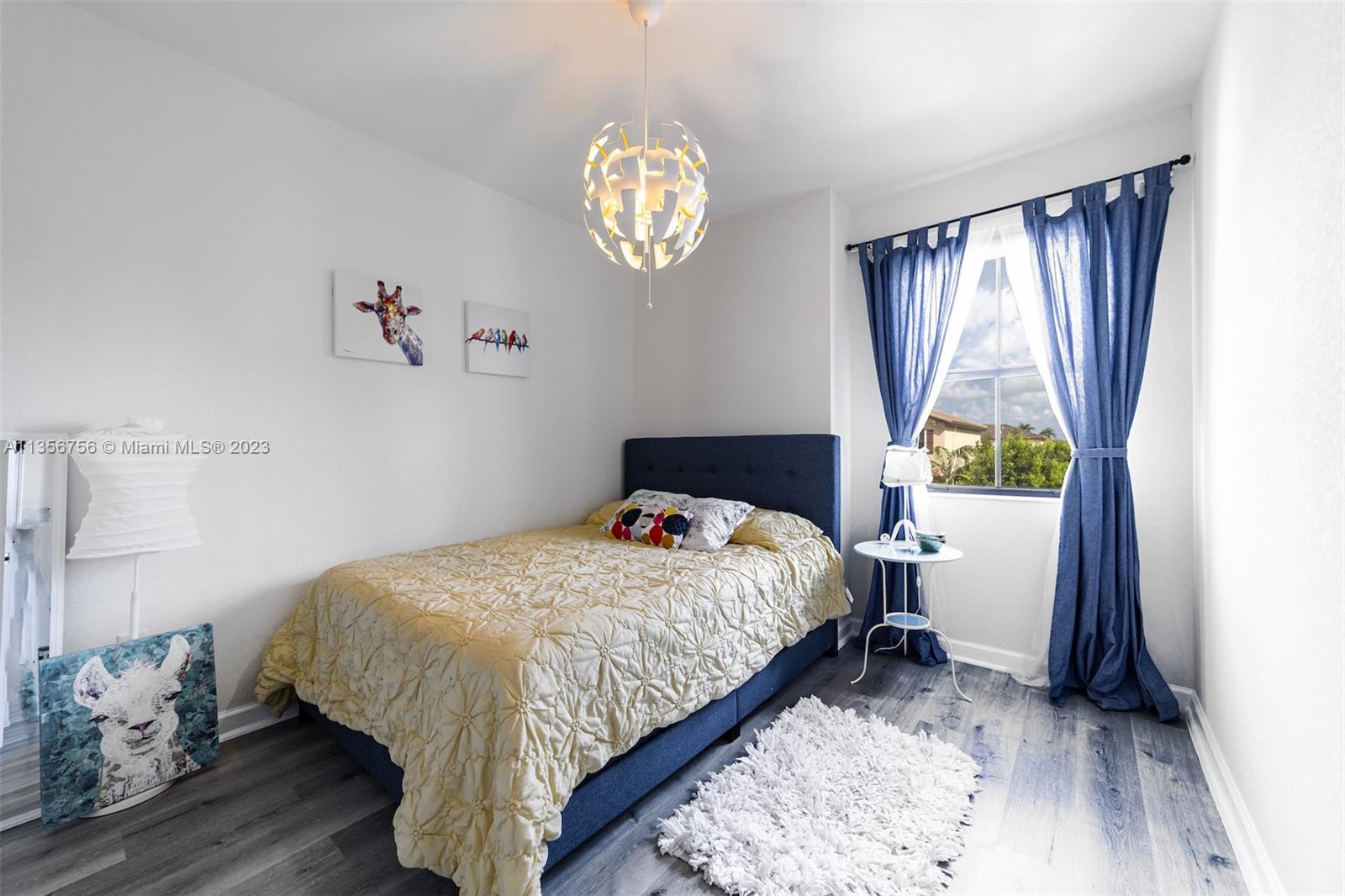 11444 Southwest 251st Street Homestead, FL 33032 - Photo 28 of 40 a bedroom with a bed and a window