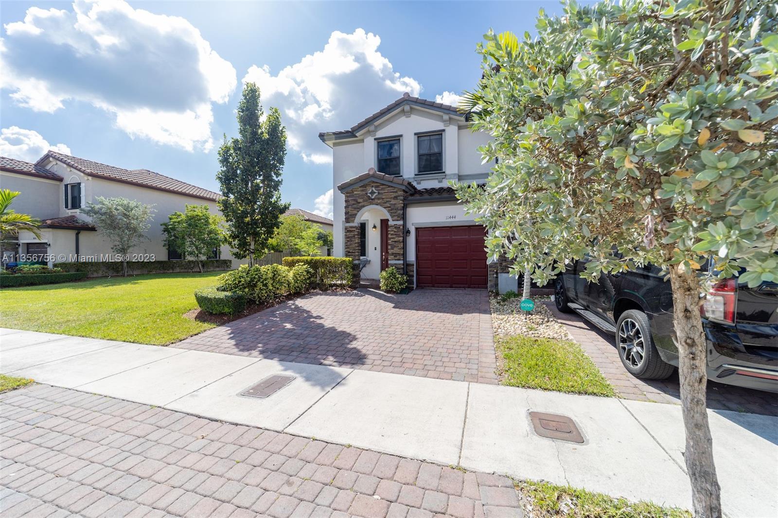 11444 Southwest 251st Street Homestead, FL 33032 - Photo 3 of 40 a view of a house with a swimming pool and a yard