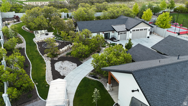 3167 South Mapleton Estates Drive Mapleton, UT 84664 - Photo 41 of 42 Contemporary residence featuring a dark shingled roof, white exterior siding, and a two-car garage