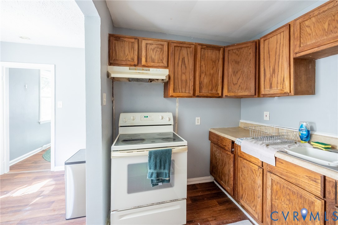 3505 Meadowbridge Road Richmond, VA 23222 - Photo 8 of 20 Kitchen featuring wood-finish cabinetry, a freesta