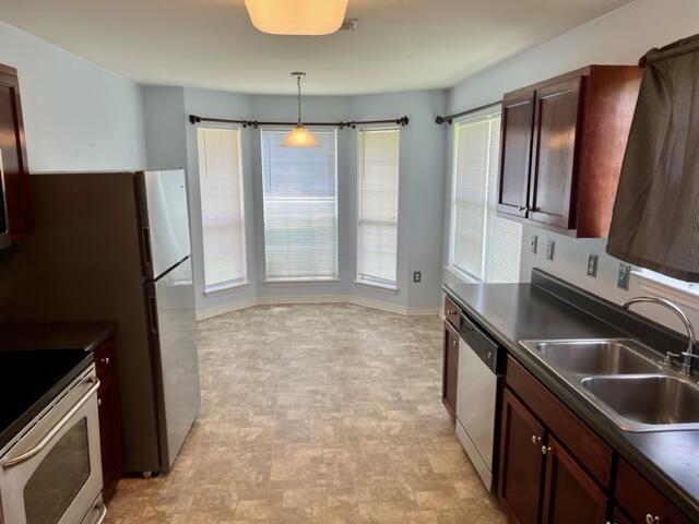 306 Shield Drive Crestview, FL 32539 - Photo 2 of 16 a kitchen with granite countertop a refrigerator and a sink