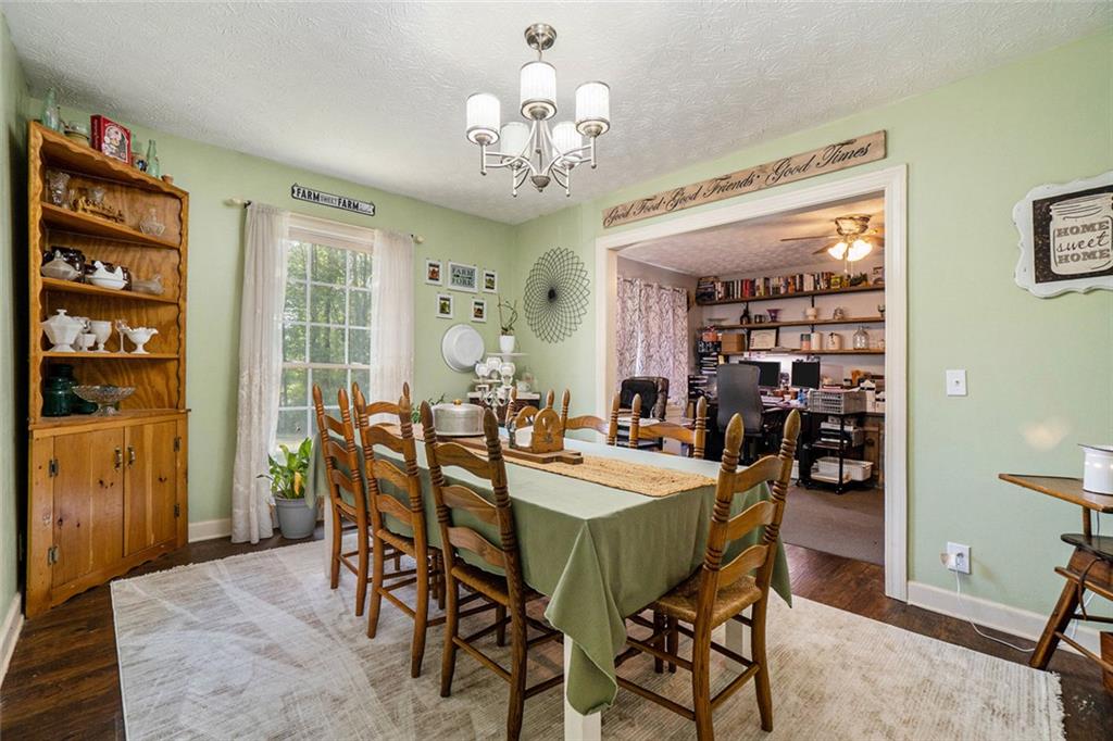 1736 Pleasant Grove Road Temple, GA 30179 - Photo 11 of 31 a view of a dining room with furniture and chandelier