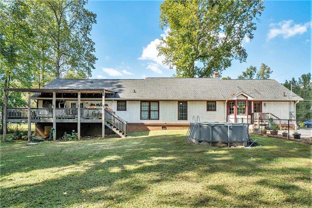 1736 Pleasant Grove Road Temple, GA 30179 - Photo 25 of 31 a view of a house with a yard and sitting area