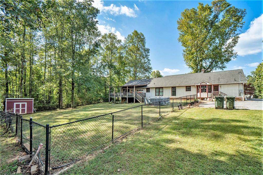 1736 Pleasant Grove Road Temple, GA 30179 - Photo 26 of 31 a view of a house with pool and sitting area