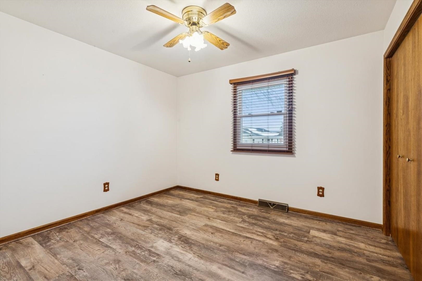 1045 Sweet Briar Lane Clinton, IA 52732 - Photo 22 of 33 a view of an empty room with a window