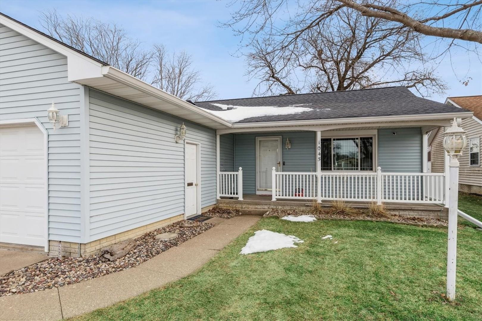 1045 Sweet Briar Lane Clinton, IA 52732 - Photo 5 of 33 a front view of a house with a yard