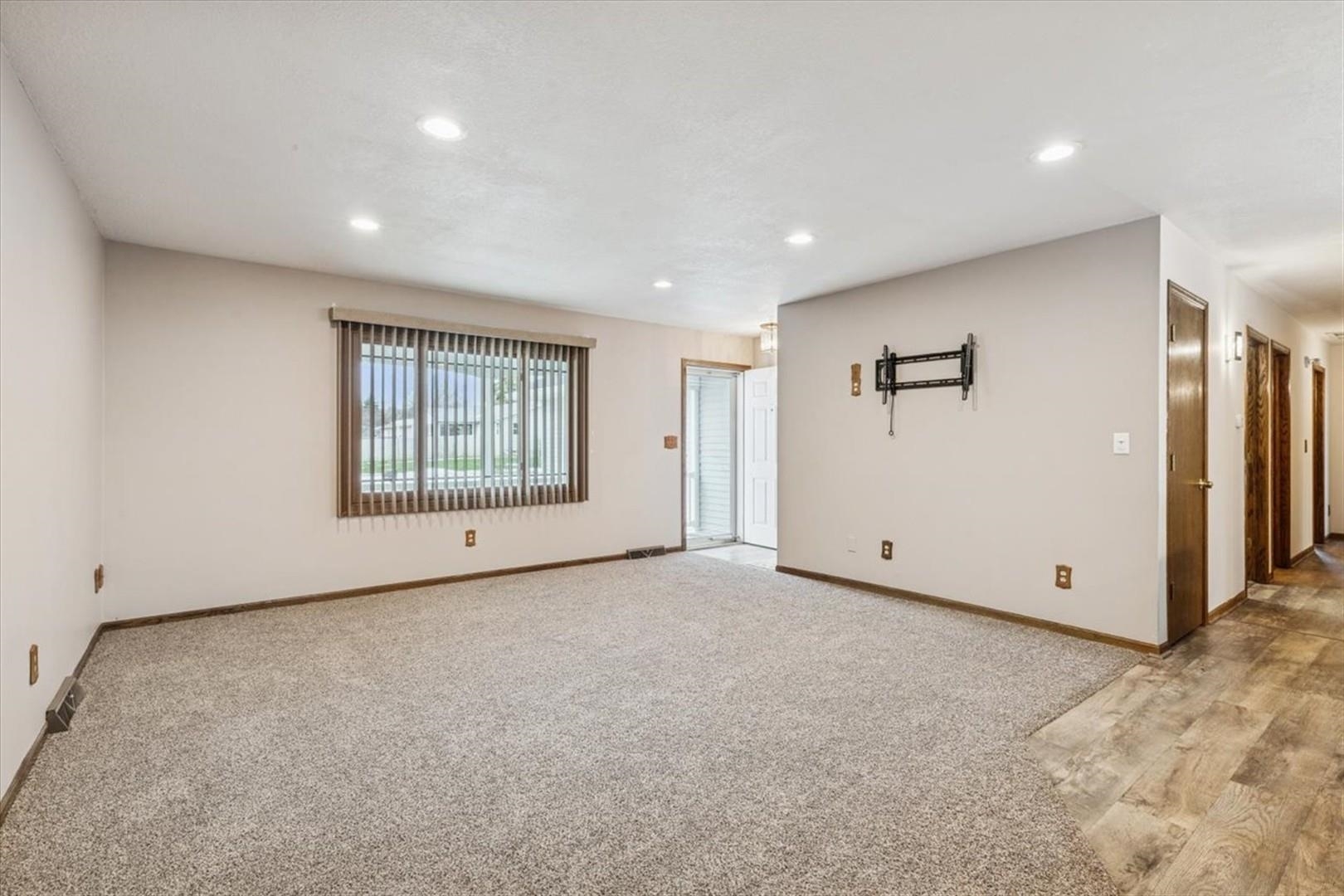 1045 Sweet Briar Lane Clinton, IA 52732 - Photo 6 of 33 a view of an empty room with a window
