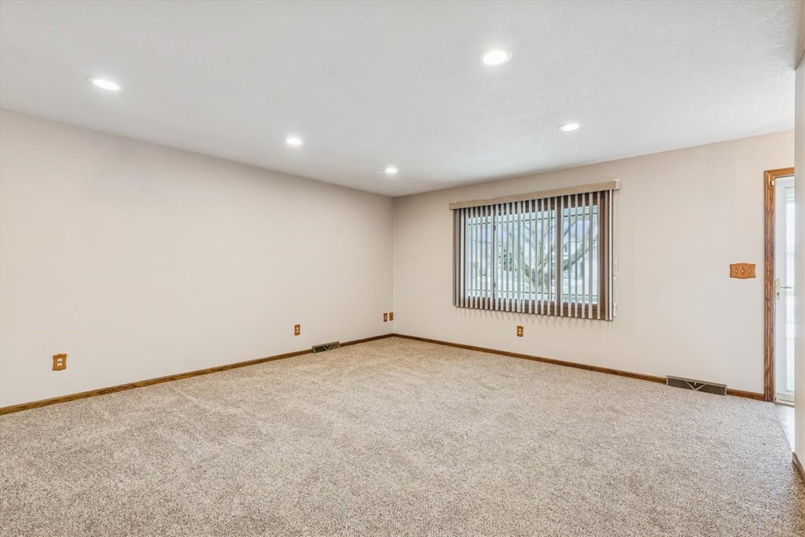 1045 Sweet Briar Lane Clinton, IA 52732 - Photo 7 of 33 an empty room with windows