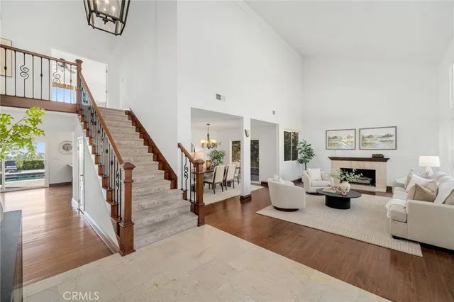 a living room with furniture and a stairs