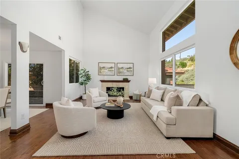 a view of a dining room and a table and chairs in wooden floor