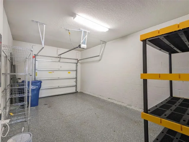 a swimming pool with outdoor seating and yard