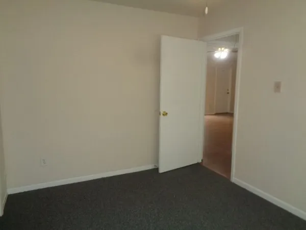 a bathroom with a toilet and a bath tub