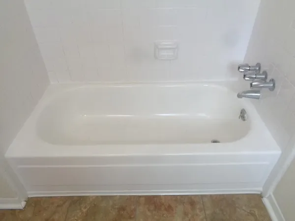 a kitchen with stainless steel appliances granite countertop a refrigerator and a stove