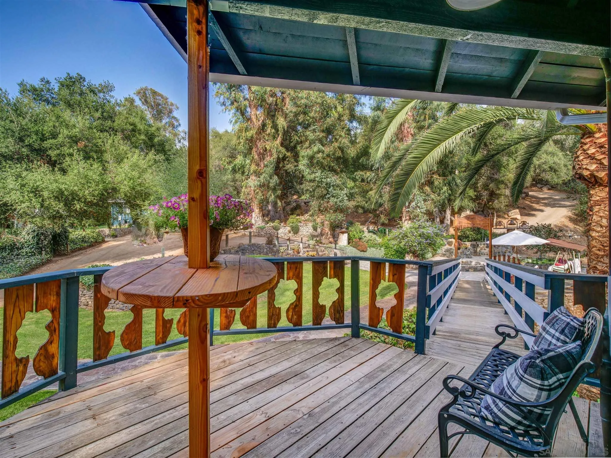 1102 Nicola Ranch Road Fallbrook, CA 92028 - Photo 12 of 63 a view of a balcony with chairs and wooden floor