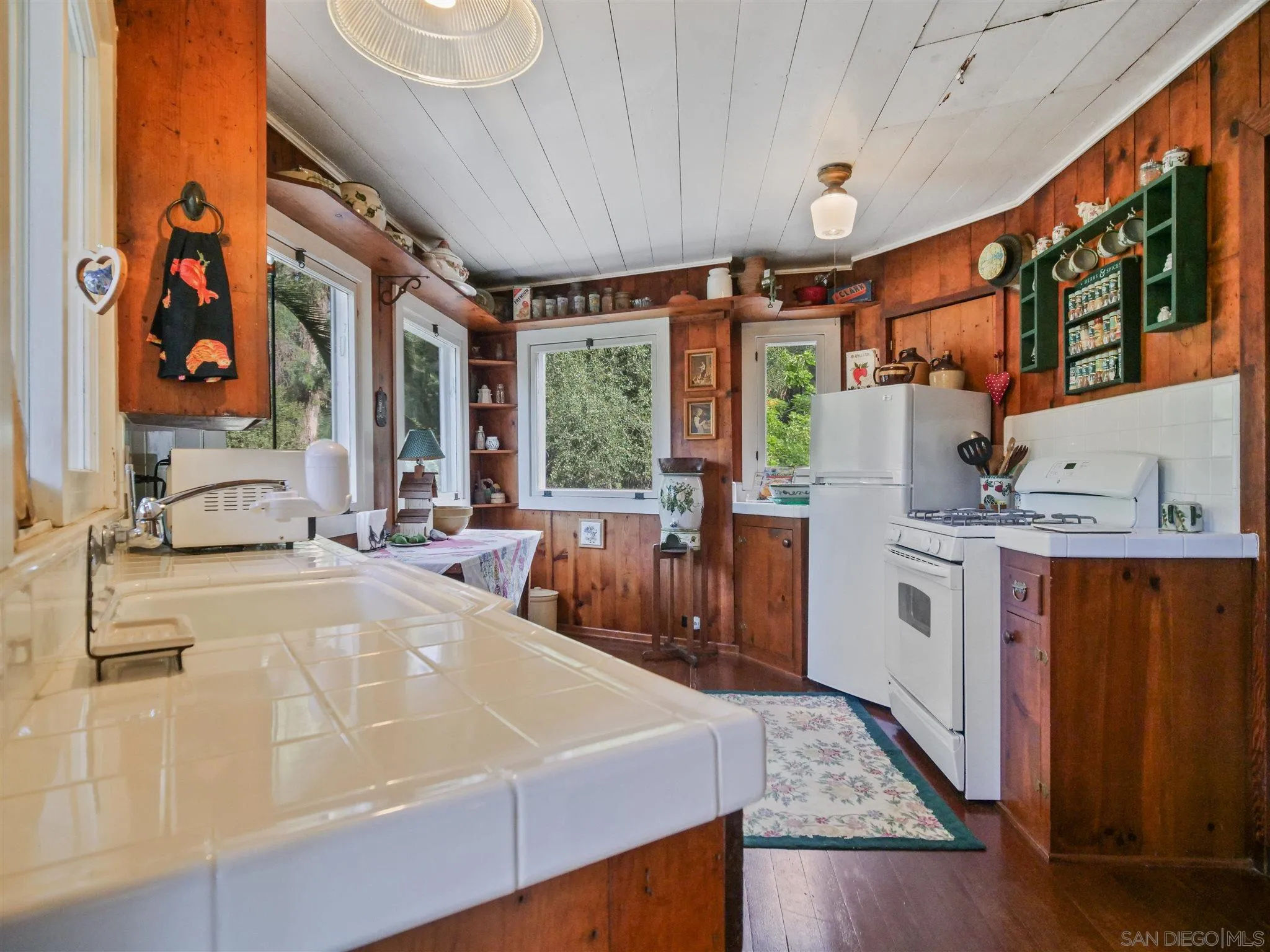 1102 Nicola Ranch Road Fallbrook, CA 92028 - Photo 14 of 63 a large white kitchen with a large window