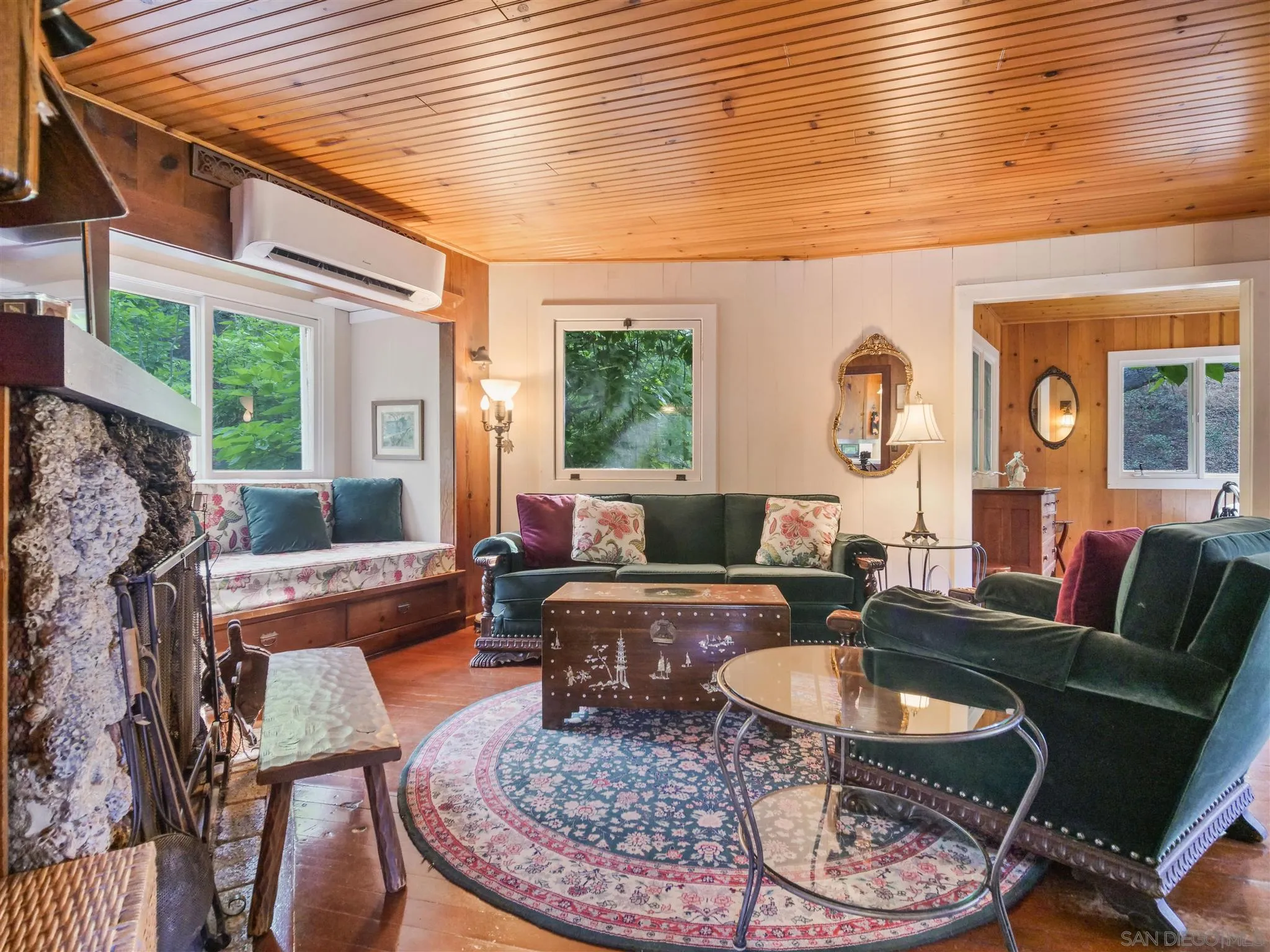 1102 Nicola Ranch Road Fallbrook, CA 92028 - Photo 16 of 63 a living room with furniture a fireplace and a table