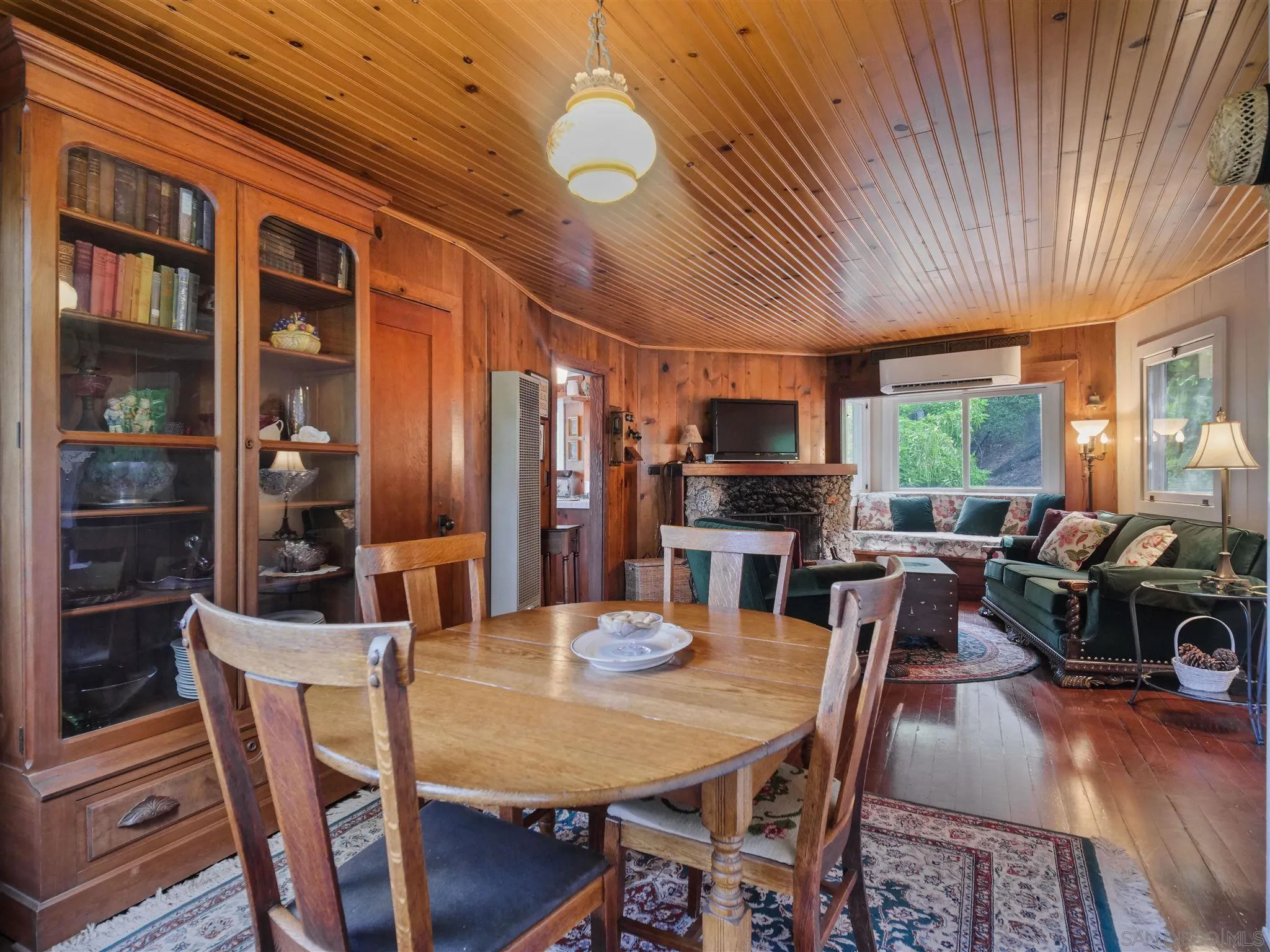 1102 Nicola Ranch Road Fallbrook, CA 92028 - Photo 19 of 63 a view of a dining room with furniture window and wooden floor