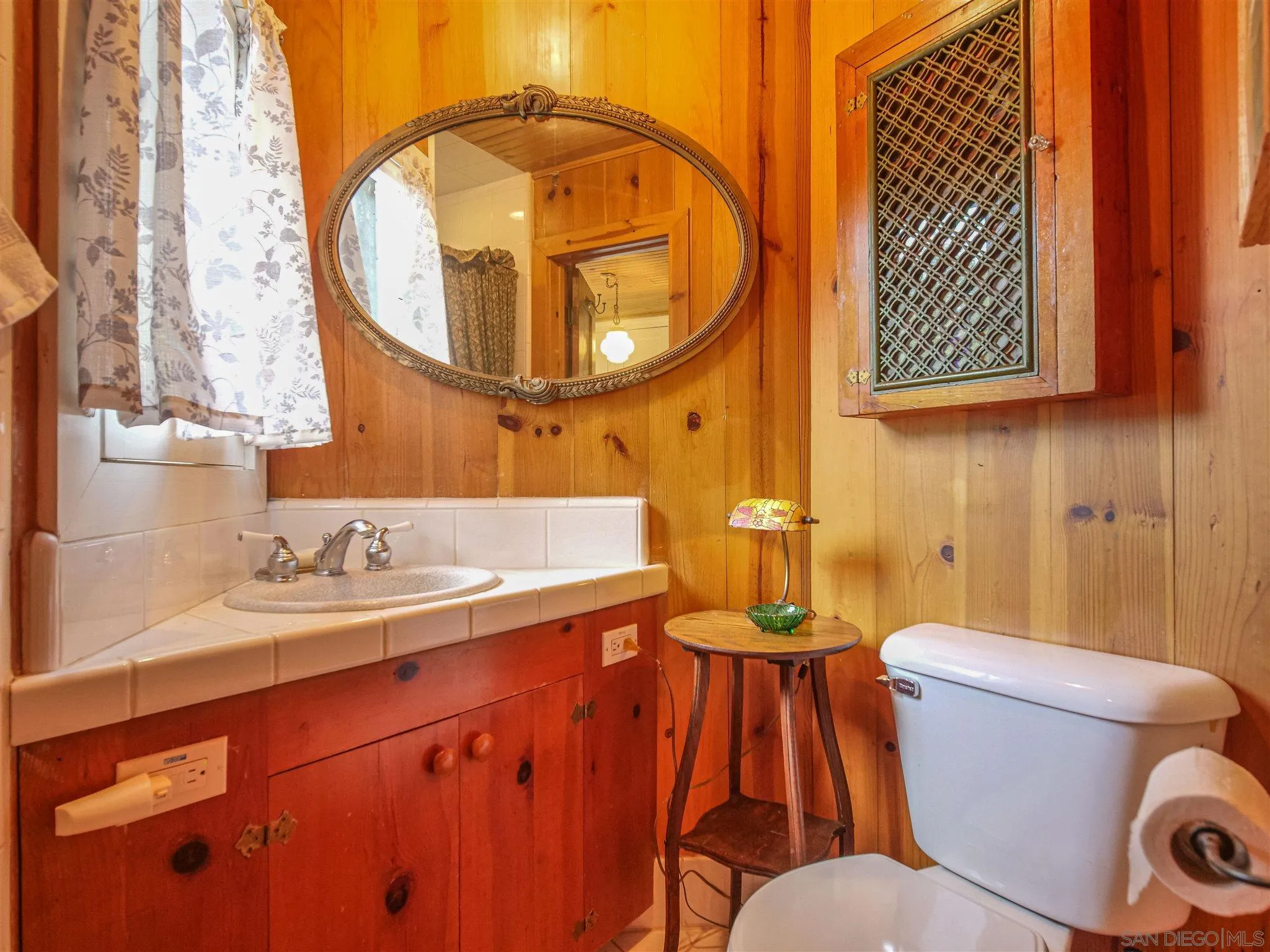 1102 Nicola Ranch Road Fallbrook, CA 92028 - Photo 20 of 63 a bathroom with a sink and a mirror