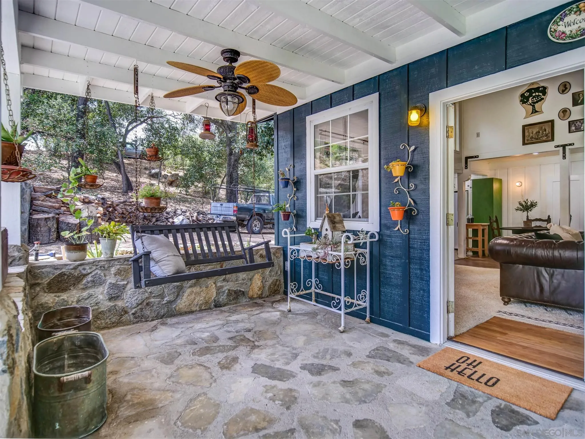 1102 Nicola Ranch Road Fallbrook, CA 92028 - Photo 26 of 63 a view of a porch with a table and chairs